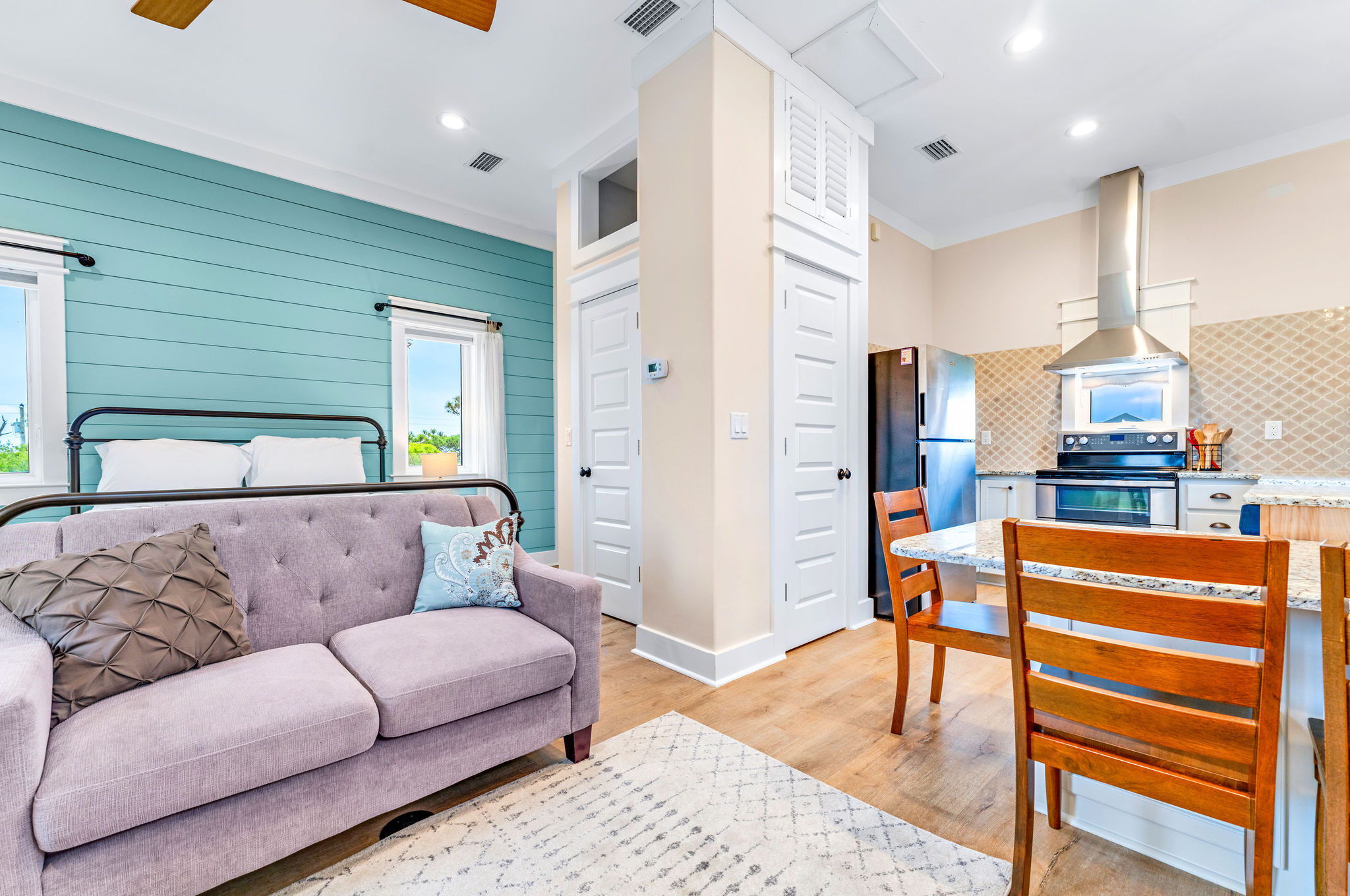Carriage house suite interior at Sanctuary Cape San Blas — queen bed, sitting area, private entrance